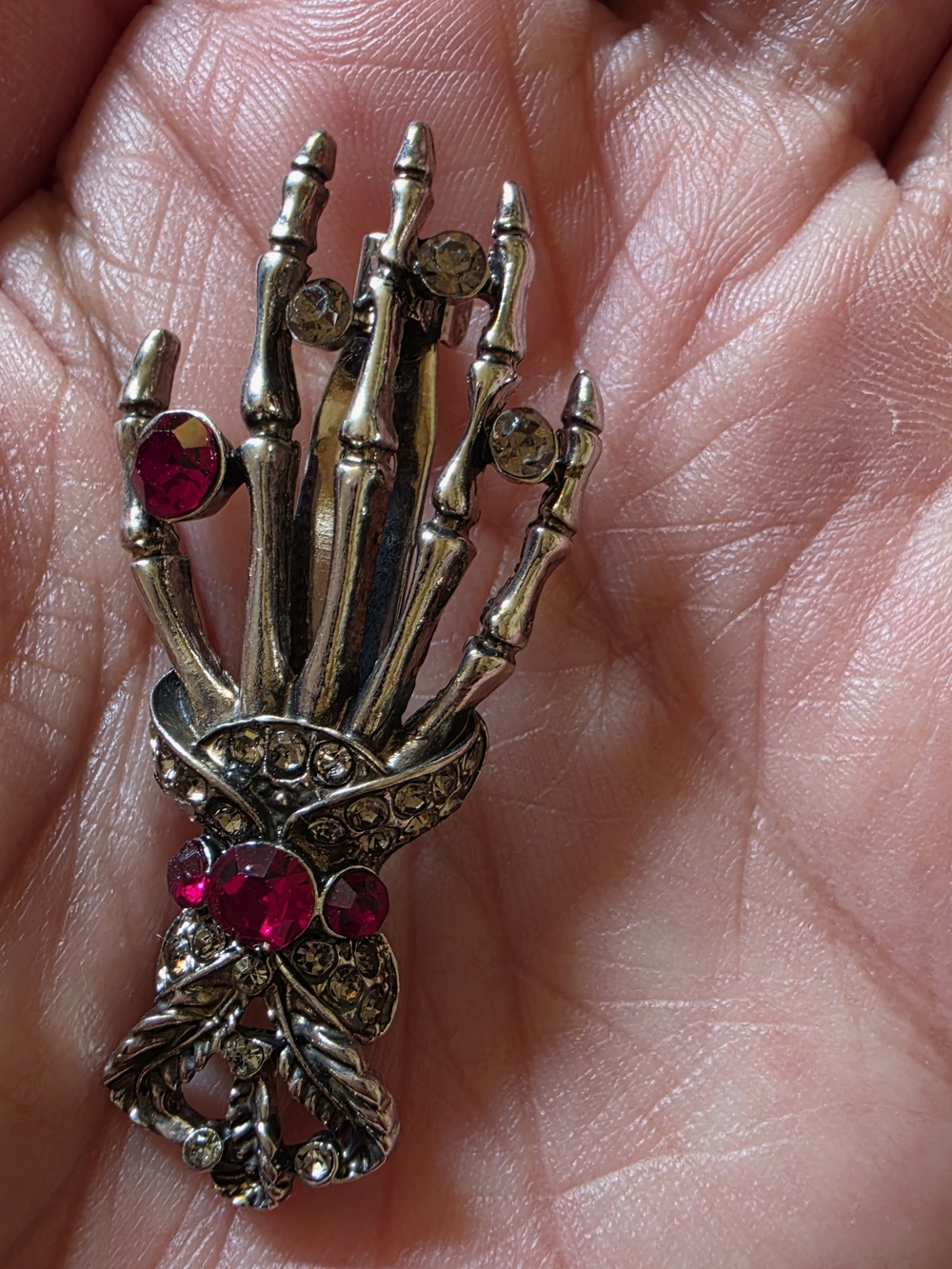 Antique Silver-Tone Skeleton Hand Brooch with Fuchsia Crystals